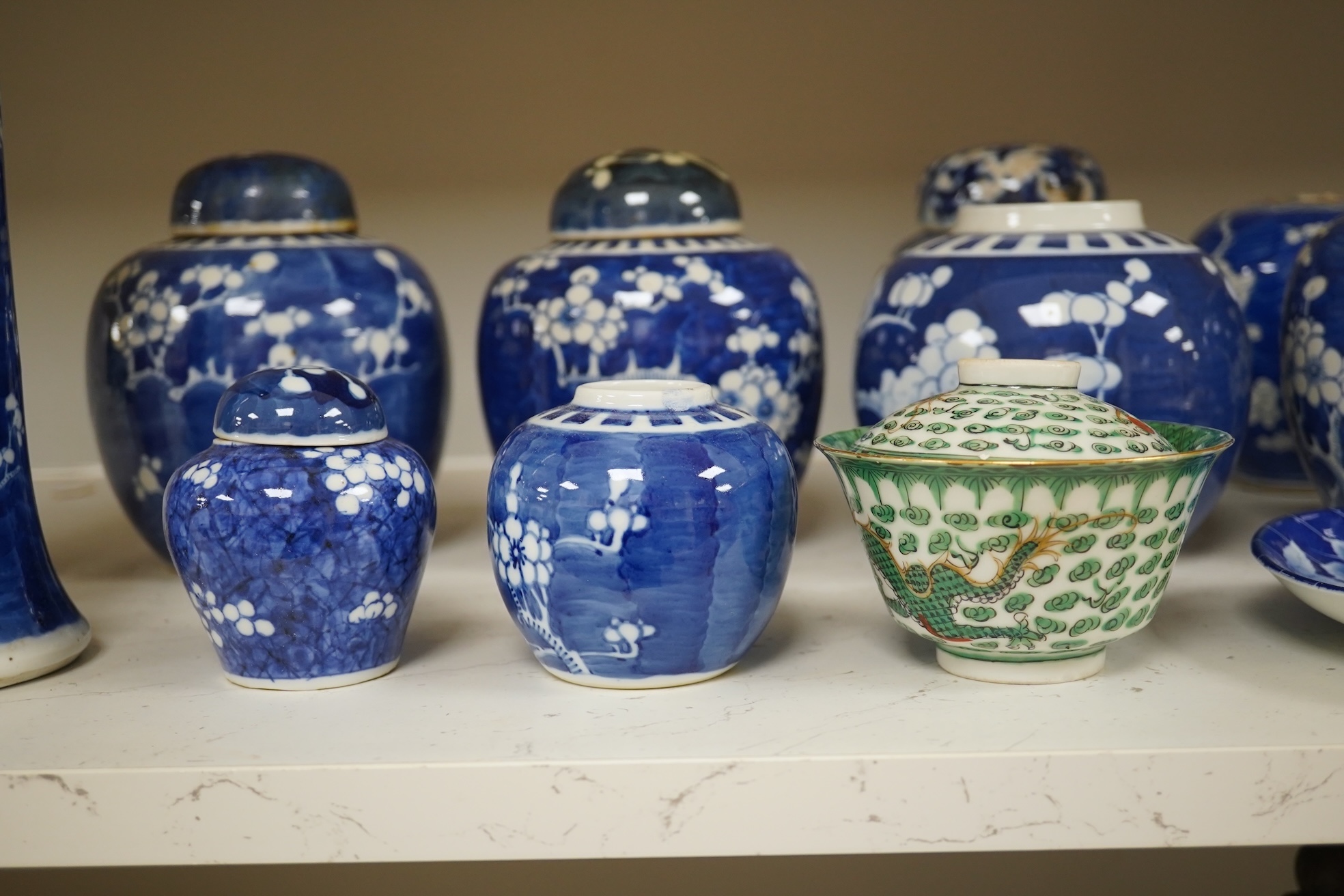 Eight Chinese blue and white ginger jars, one prunus vase and two others, the vase 25cm high. Condition - varies